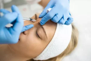 Beautician makes botox injections
